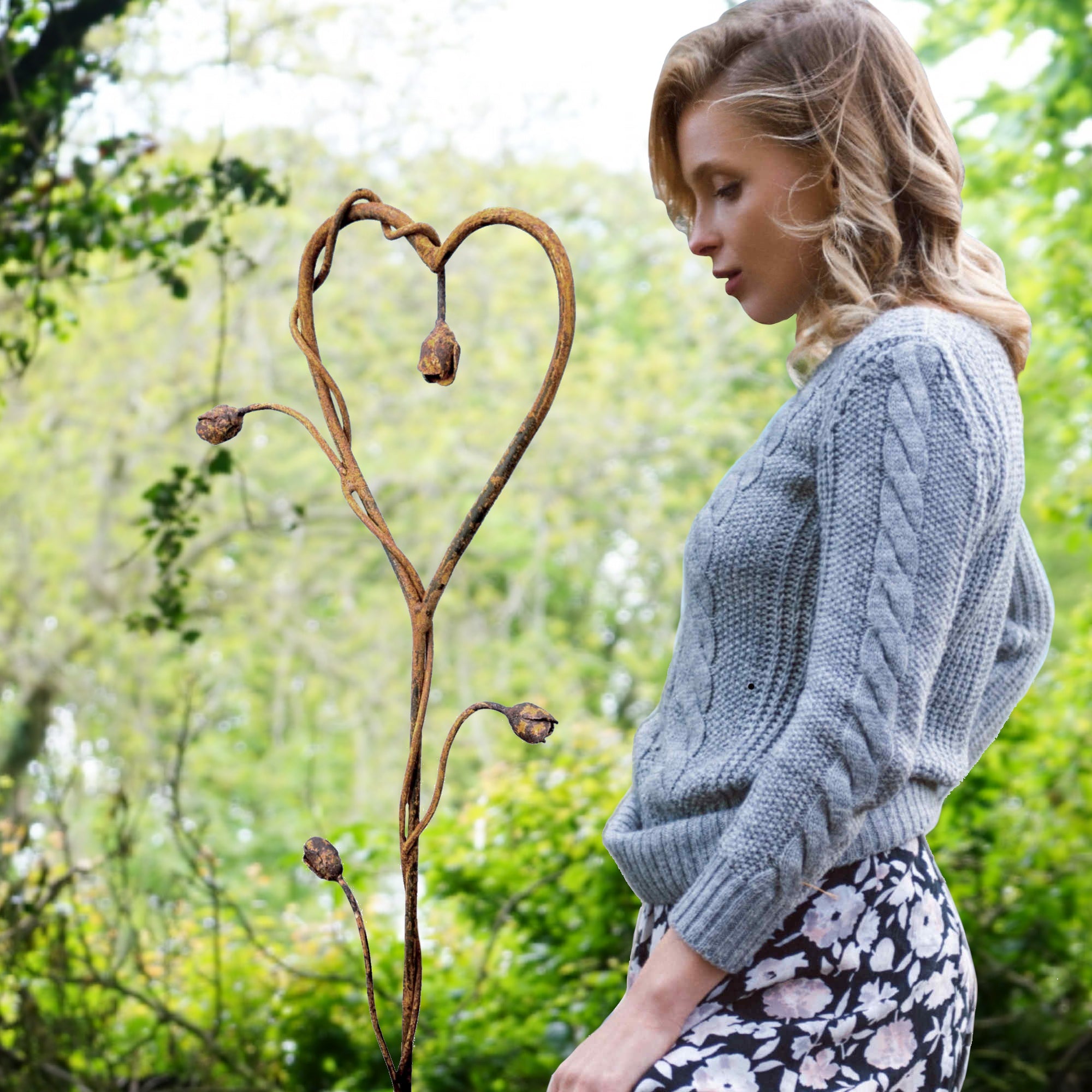 Rusty metal Climbing Rose Heart. Garden flower sculpture image 0