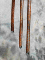 Close up image showing the rounded tips of the daisy flower stakes.